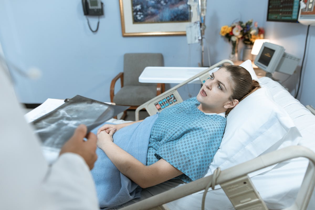 Patient Talking while Lying Down on a Hospital Bed