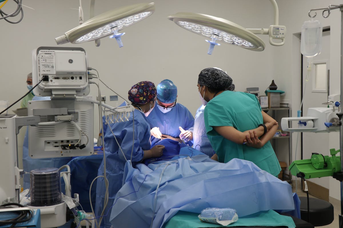 Doctor and Nurses Operating in a Operating Room