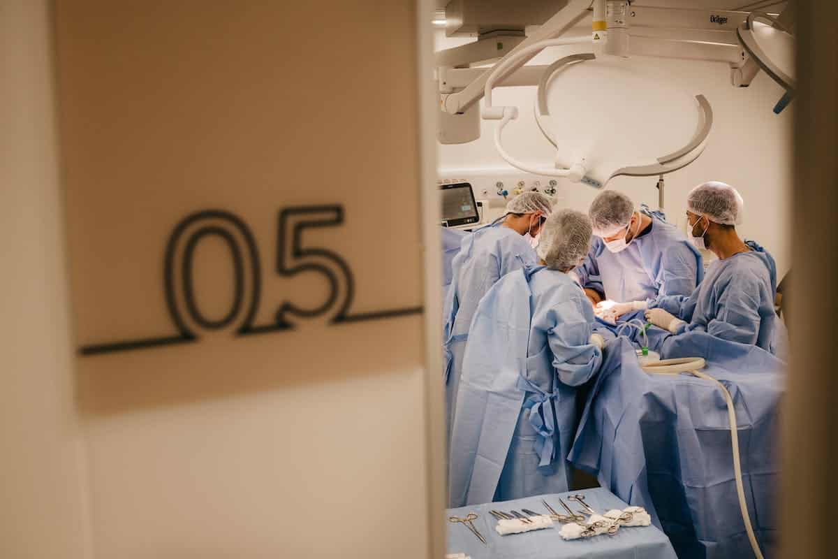 Doctors Performing a Surgery in the Operating Room