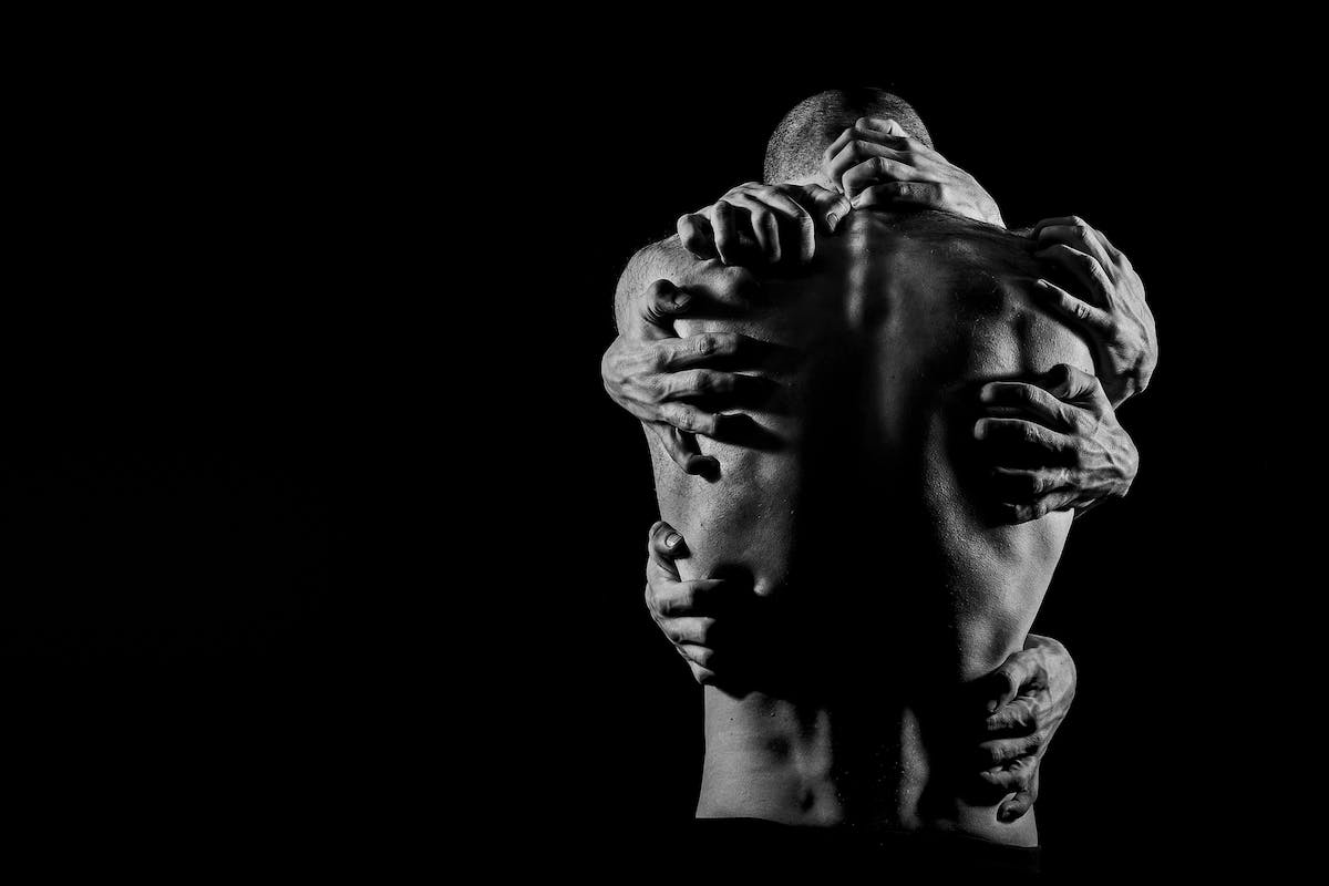 Hands on Back of Man