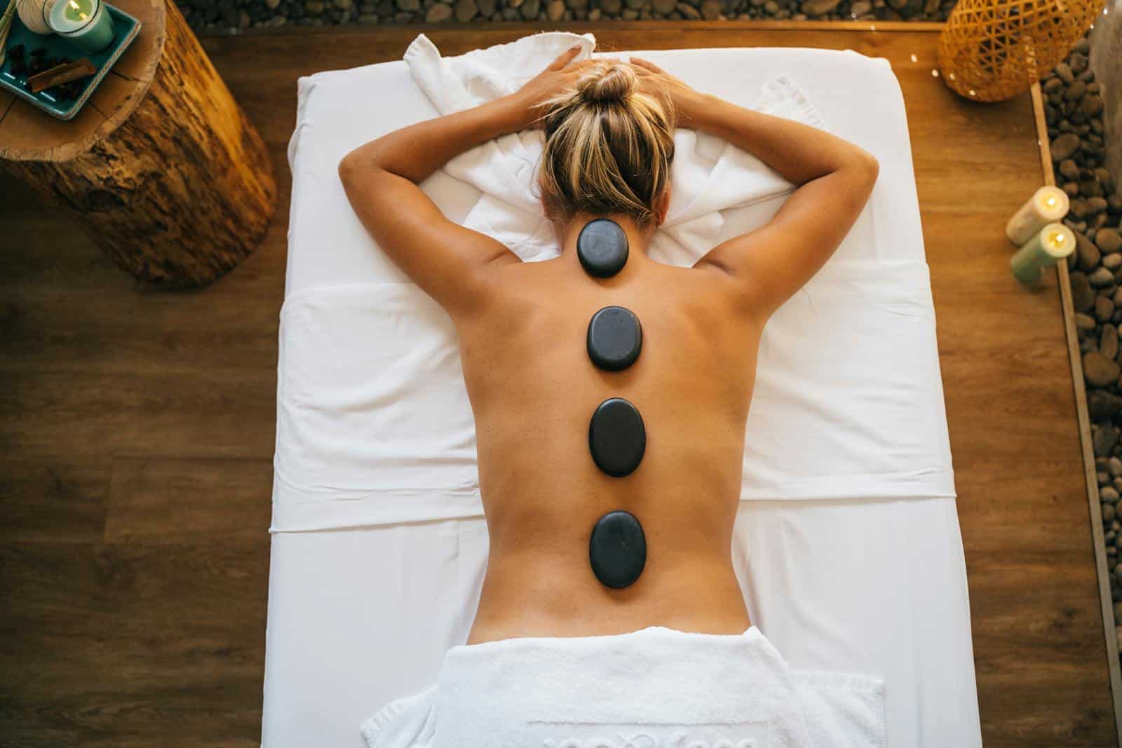Stones on a Woman's Bare Back