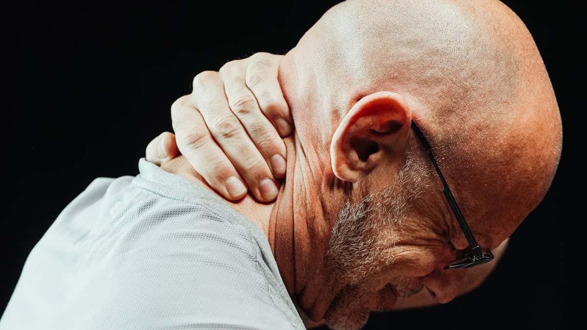 Close-Up Photo of a Man Having a Neck Pain