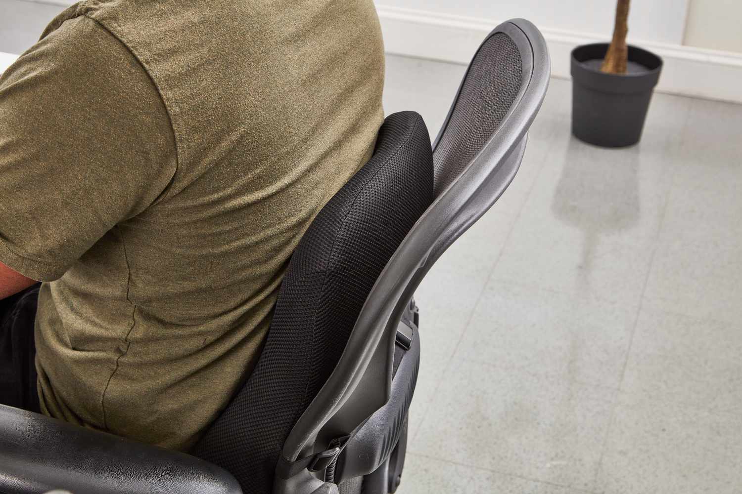 Man sitting on the chair with cushion